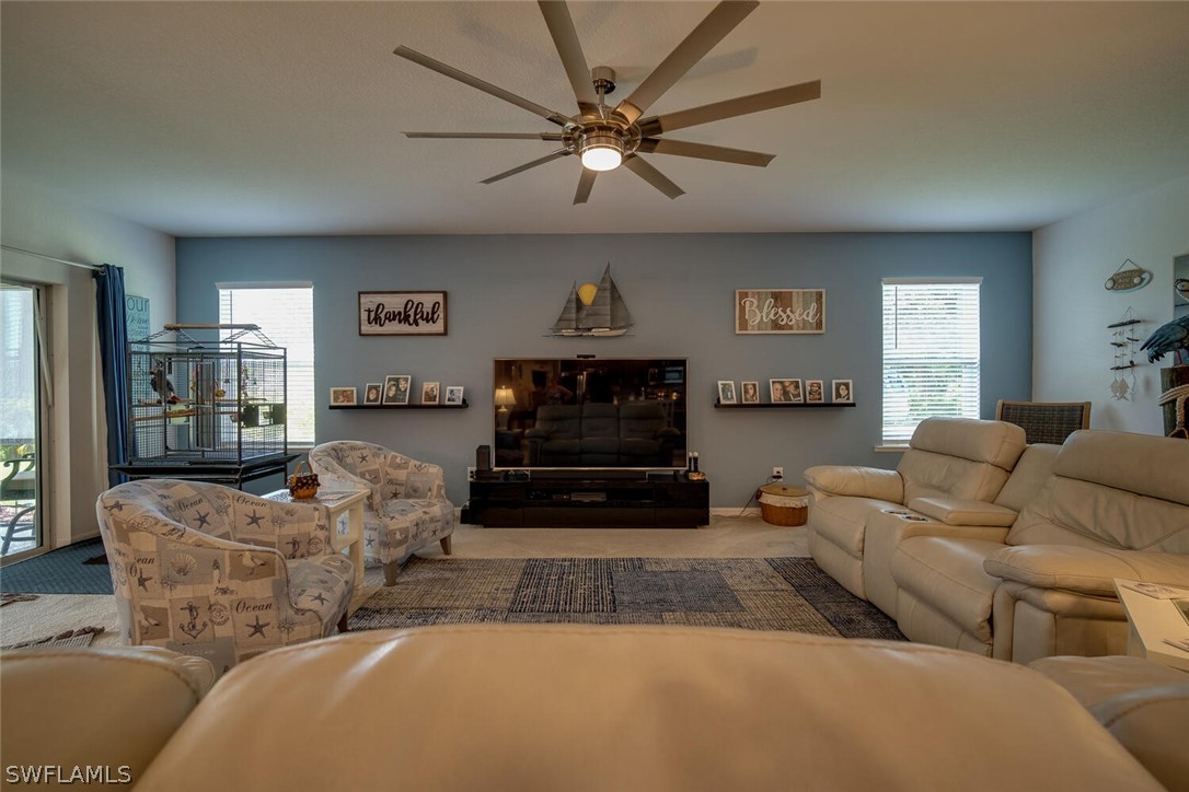 1212 Oceanic Road Punta Gorda, FL 33983 - Photo 6 of 29 a living room with furniture and a fireplace