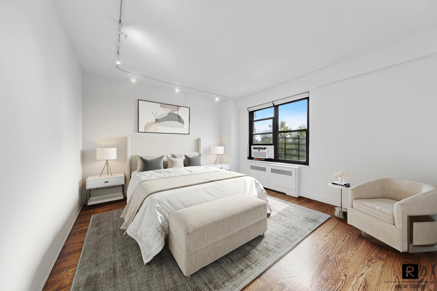 264 East Broadway, Unit C405 Manhattan, NY 10002 - Photo 5 of 12 a spacious bedroom with a bed and a large window
