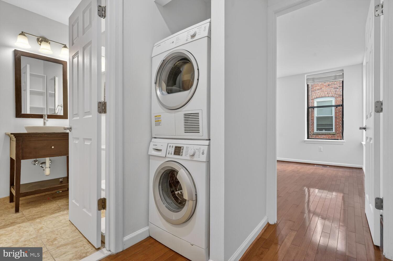 2627 Adams Mill Road Northwest, Unit 104 Washington, DC 20009 - Photo 14 of 16 a view of a hallway with washer and dryer