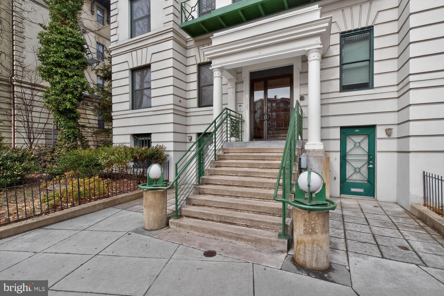 2627 Adams Mill Road Northwest, Unit 104 Washington, DC 20009 - Photo 2 of 16 a front view of a house with a porch