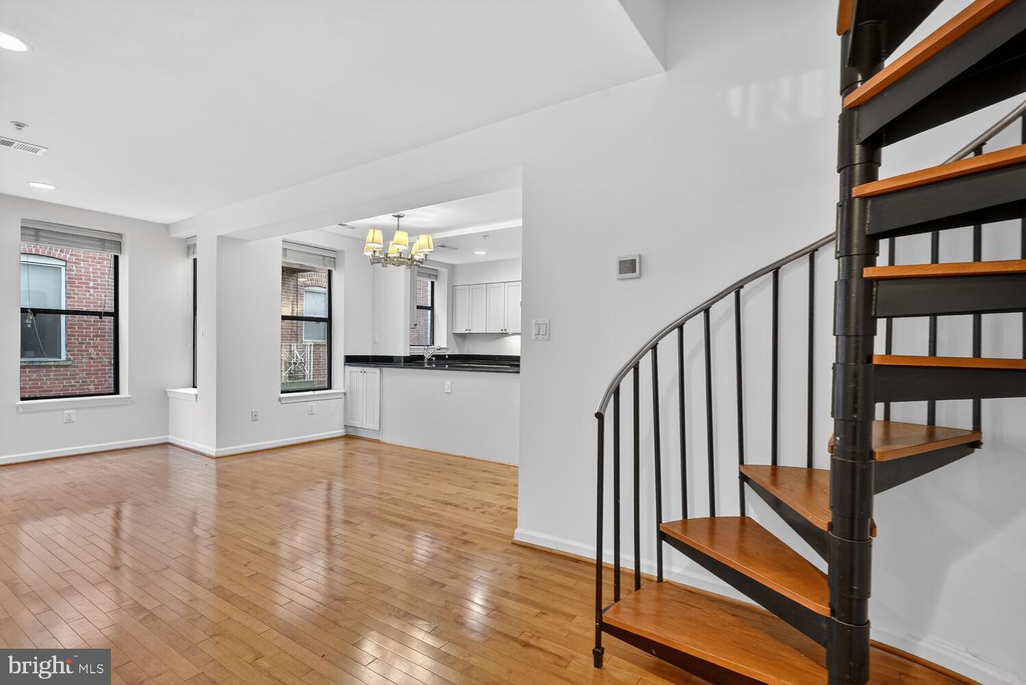 2627 Adams Mill Road Northwest, Unit 104 Washington, DC 20009 - Photo 6 of 16 a view of entryway and hall with wooden floor