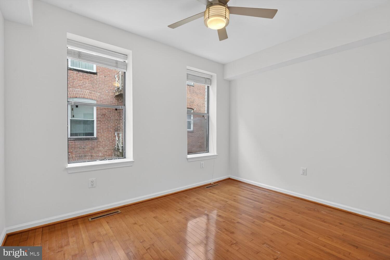 2627 Adams Mill Road Northwest, Unit 104 Washington, DC 20009 - Photo 10 of 16 an empty room with a window