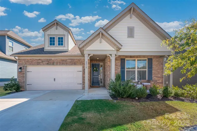 a view of a hallway with a door and couch