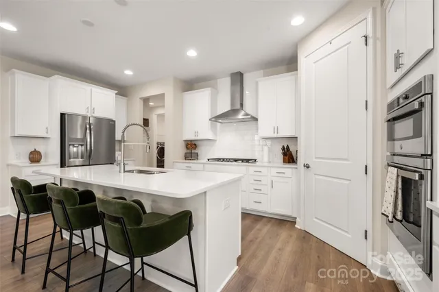 a view of a chairs and table in the balcony