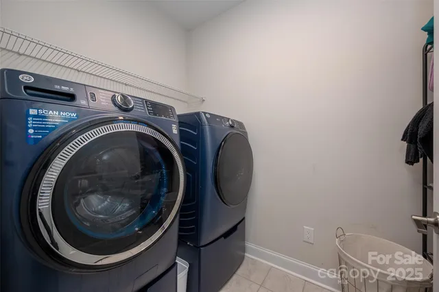 a view of swimming pool with outdoor seating and plants