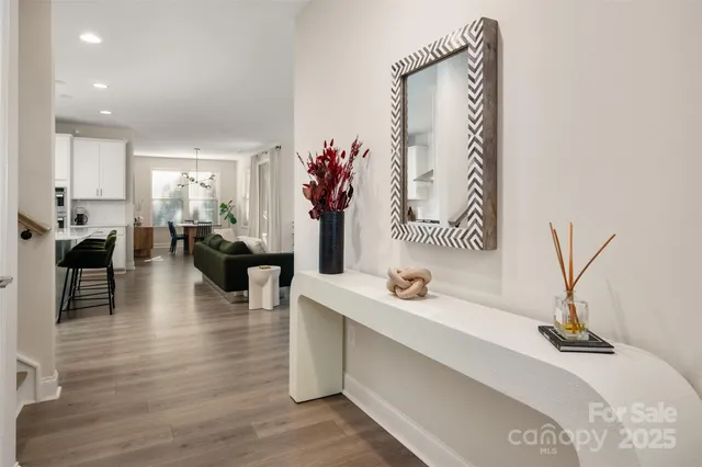 a view of a kitchen area with furniture and a potted plant