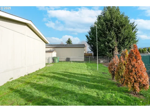 a backyard of a house with lots of green space