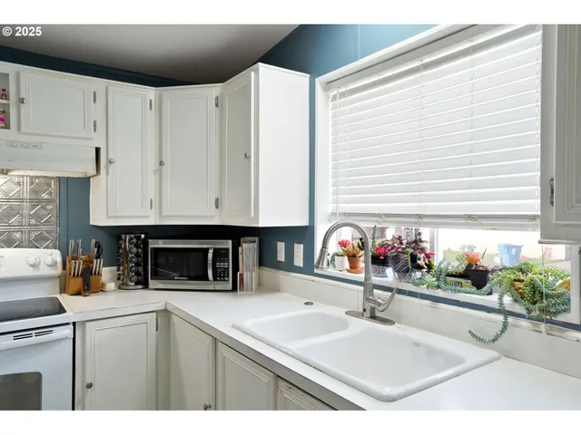 a kitchen with a sink and cabinets