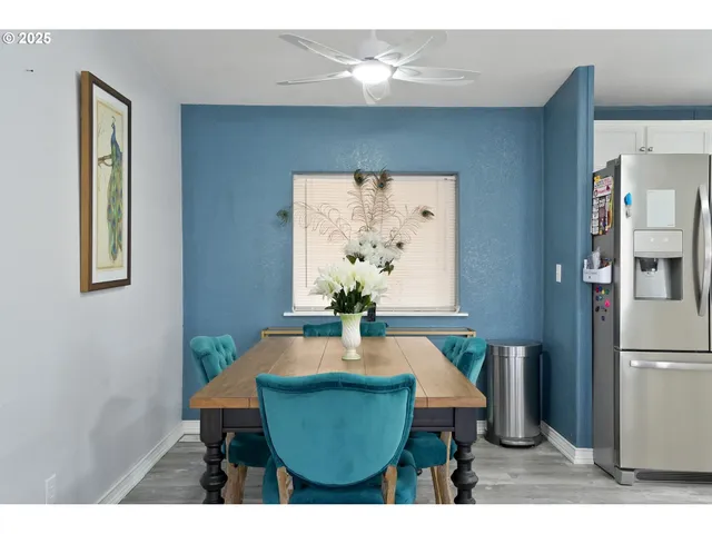 a dining room with furniture and window