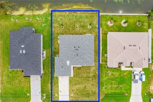 a aerial view of a house with a yard