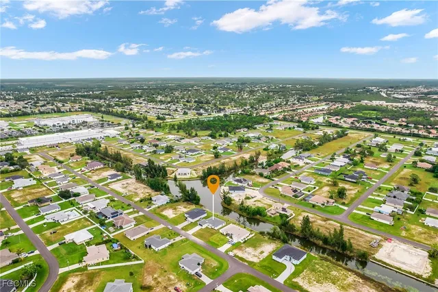 an aerial view of residential building with parking space