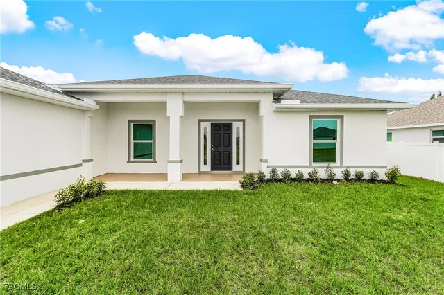 front view of a house with a yard