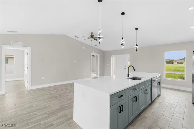 a spacious bathroom with double vanity and a mirror