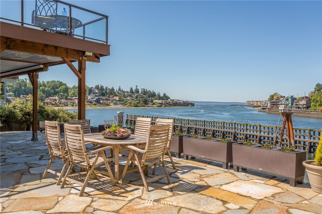 3500 West Commodore Way Seattle, WA 98199 - Photo 1 of 25 a view of a chairs and table on the terrace