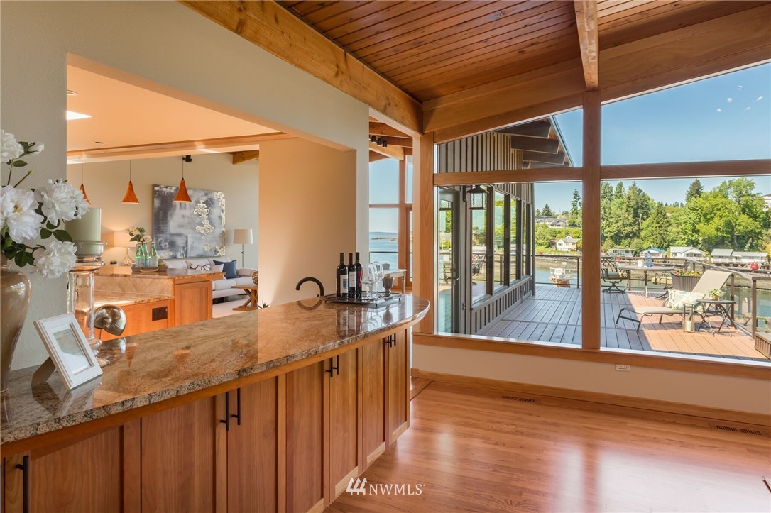 3500 West Commodore Way Seattle, WA 98199 - Photo 11 of 25 a view of a living room and kitchen with furniture
