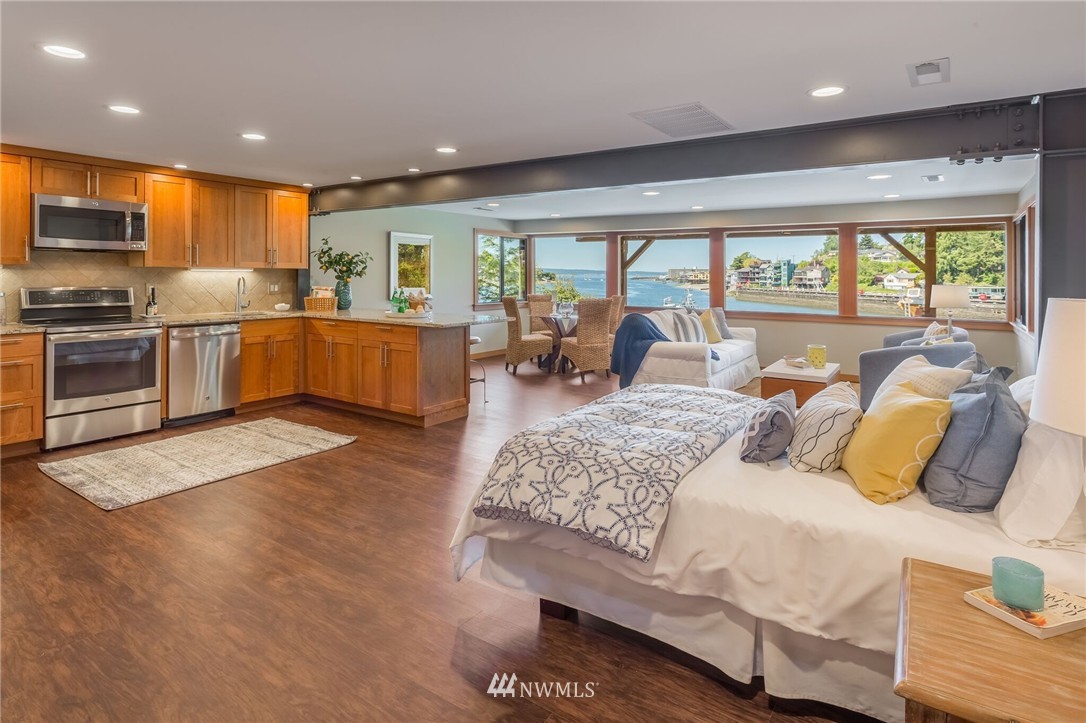 3500 West Commodore Way Seattle, WA 98199 - Photo 18 of 25 a large bedroom with a large bed and furniture