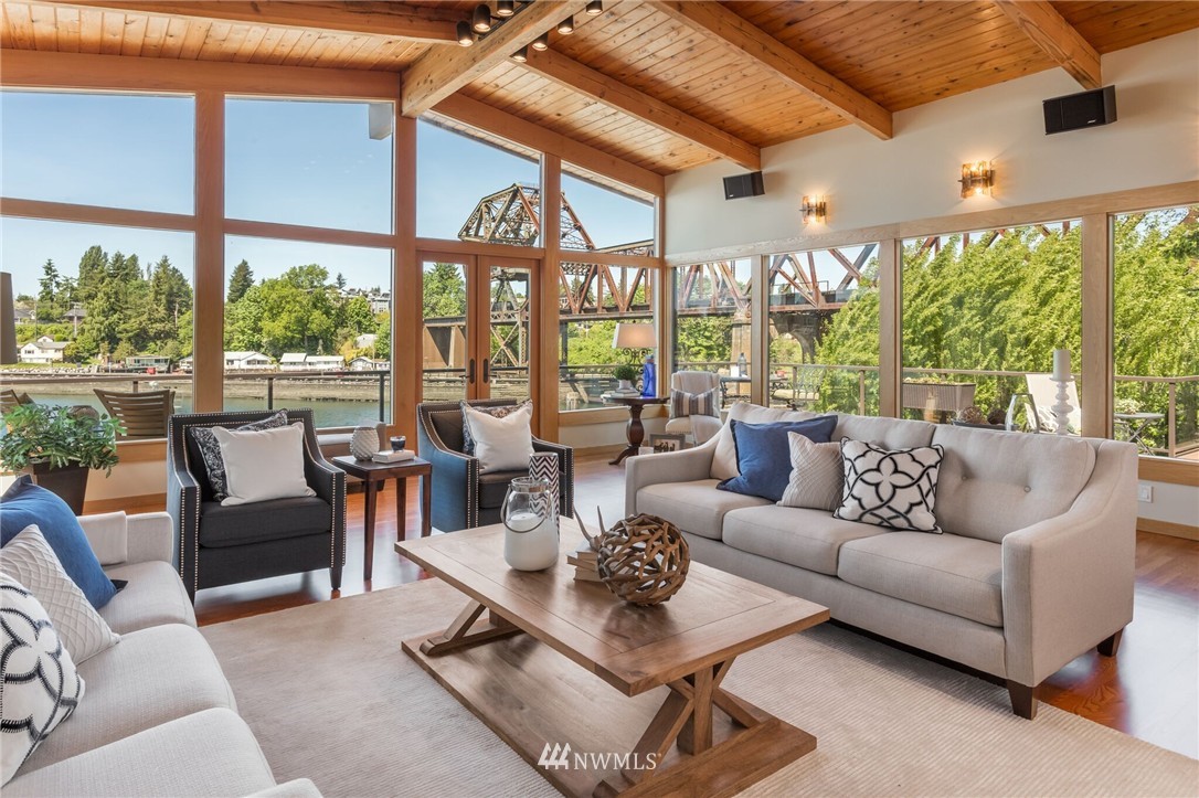 3500 West Commodore Way Seattle, WA 98199 - Photo 3 of 25 a living room with patio furniture and a large window