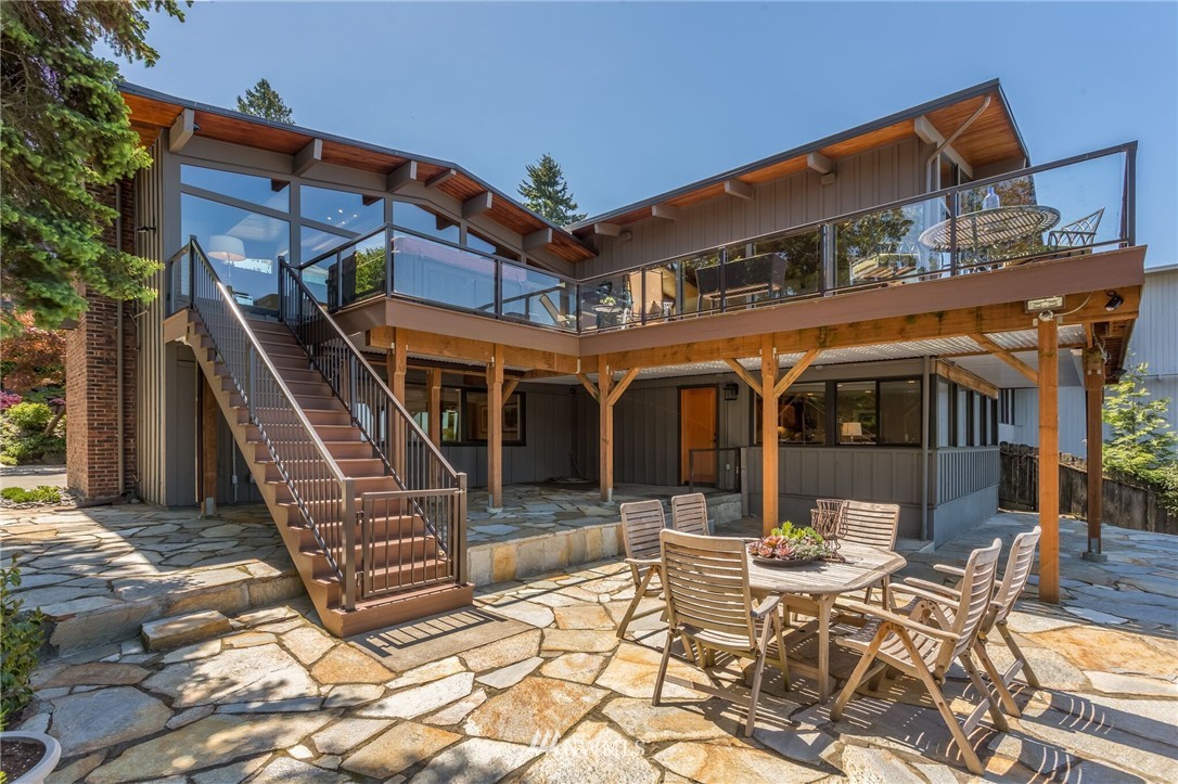 3500 West Commodore Way Seattle, WA 98199 - Photo 23 of 25 a view of a patio with a table and chairs