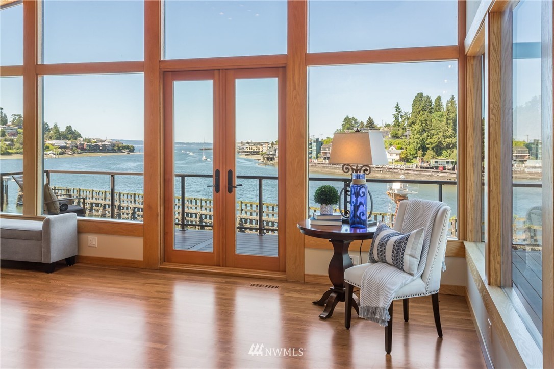 3500 West Commodore Way Seattle, WA 98199 - Photo 4 of 25 a view of a dining room with furniture window and wooden floor