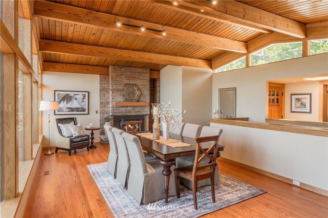 3500 West Commodore Way Seattle, WA 98199 - Photo 9 of 25 a dining room with furniture and wooden floor