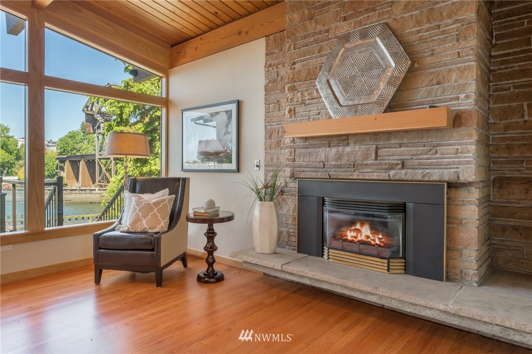 3500 West Commodore Way Seattle, WA 98199 - Photo 10 of 25 a living room with furniture and a fireplace