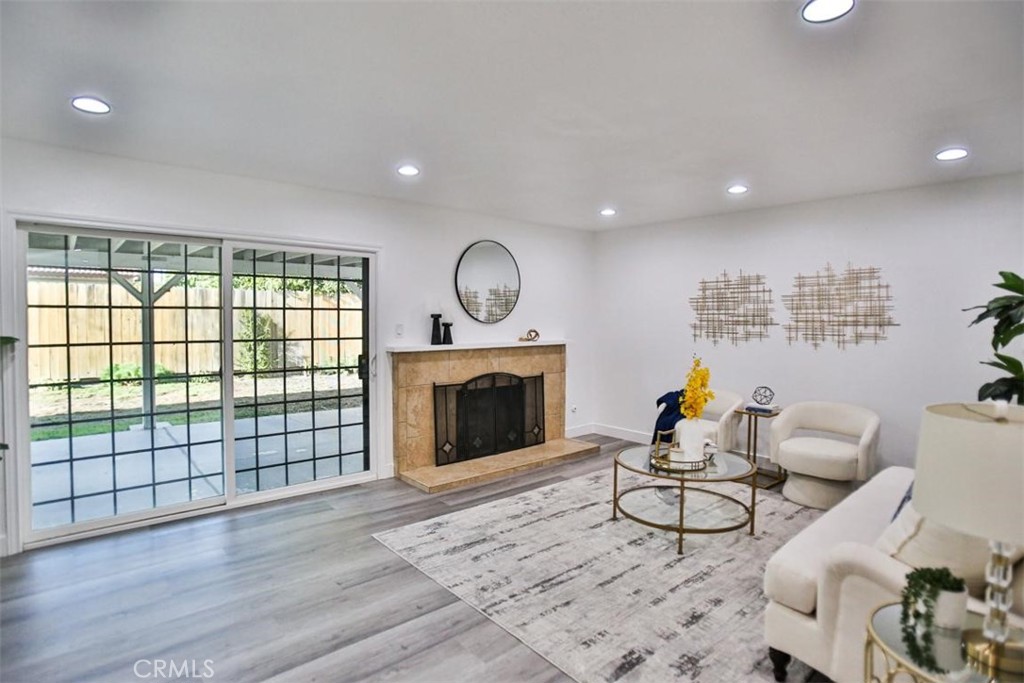 9485 Geranium Circle Fountain Valley, CA 92708 - Photo 14 of 36 a living room with furniture and a fireplace