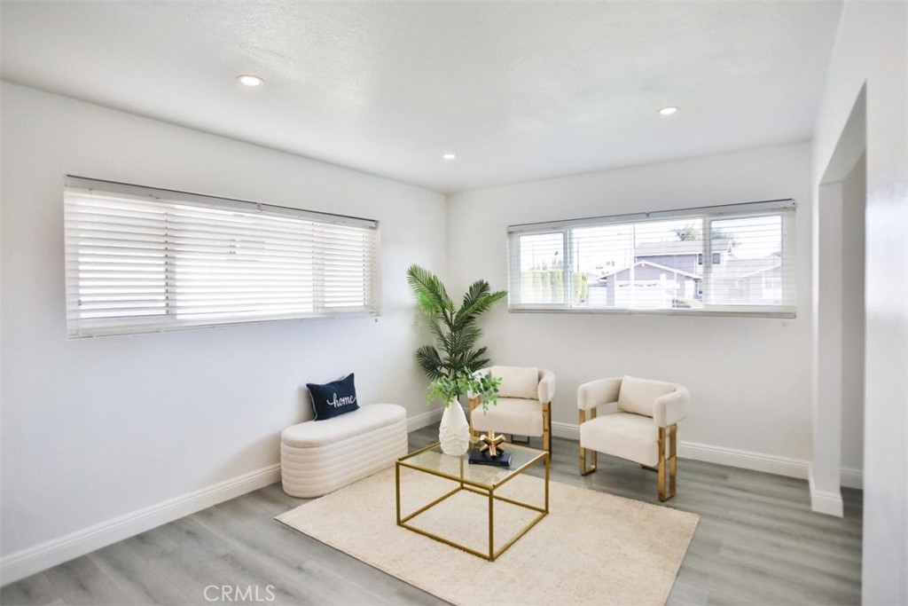 9485 Geranium Circle Fountain Valley, CA 92708 - Photo 26 of 36 a living room with furniture and a large window
