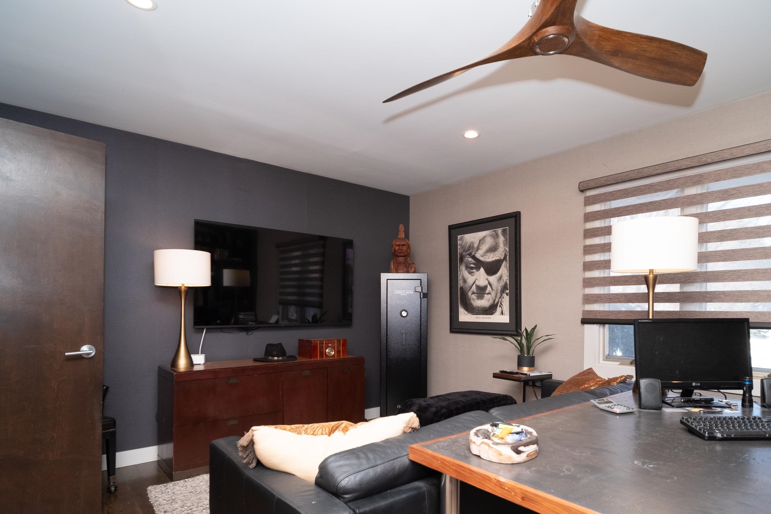 6811 West Gate Road Roscoe, IL 61073 - Photo 30 of 61 a living room with furniture and a flat screen tv