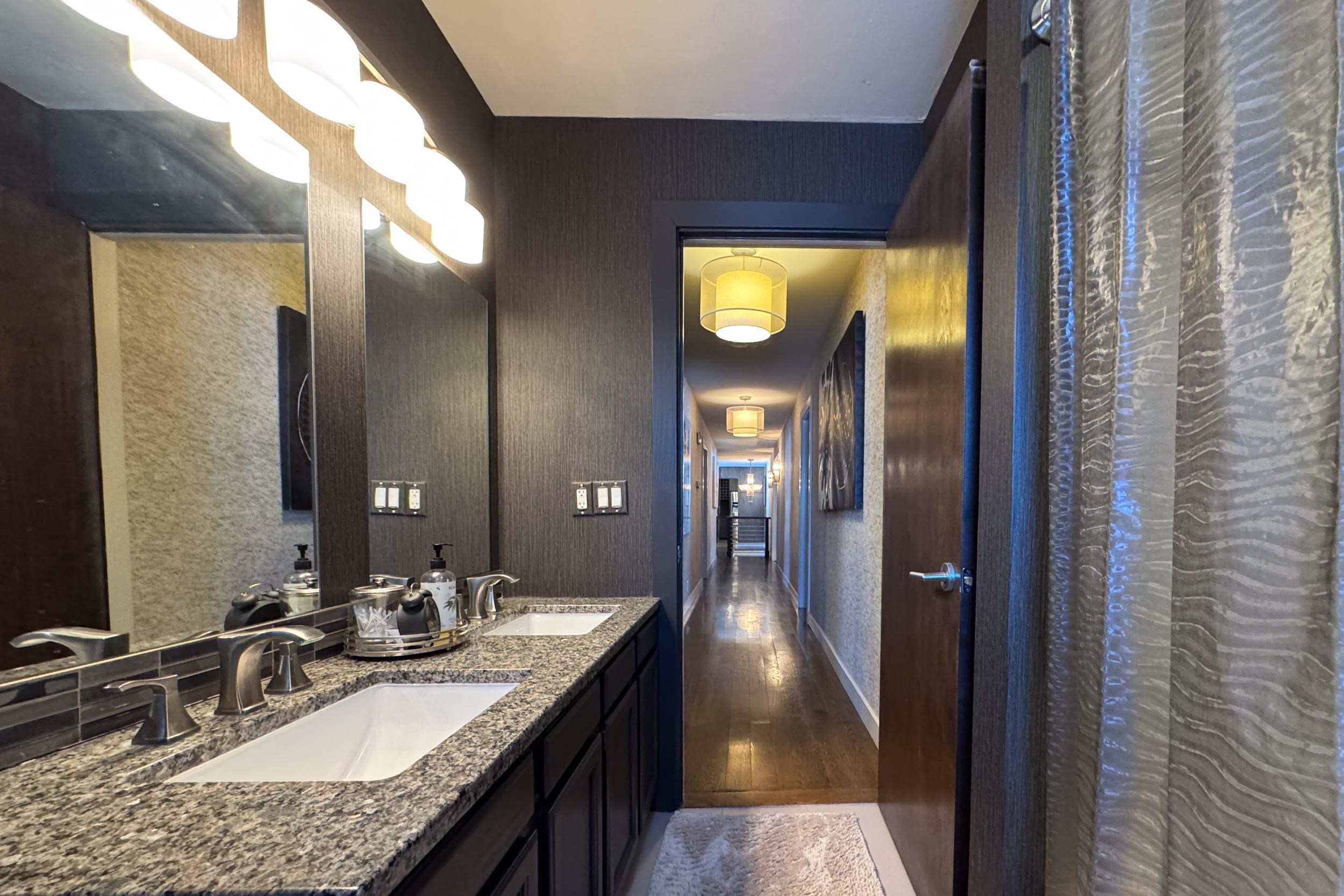6811 West Gate Road Roscoe, IL 61073 - Photo 36 of 61 a bathroom with a granite countertop sink and a mirror