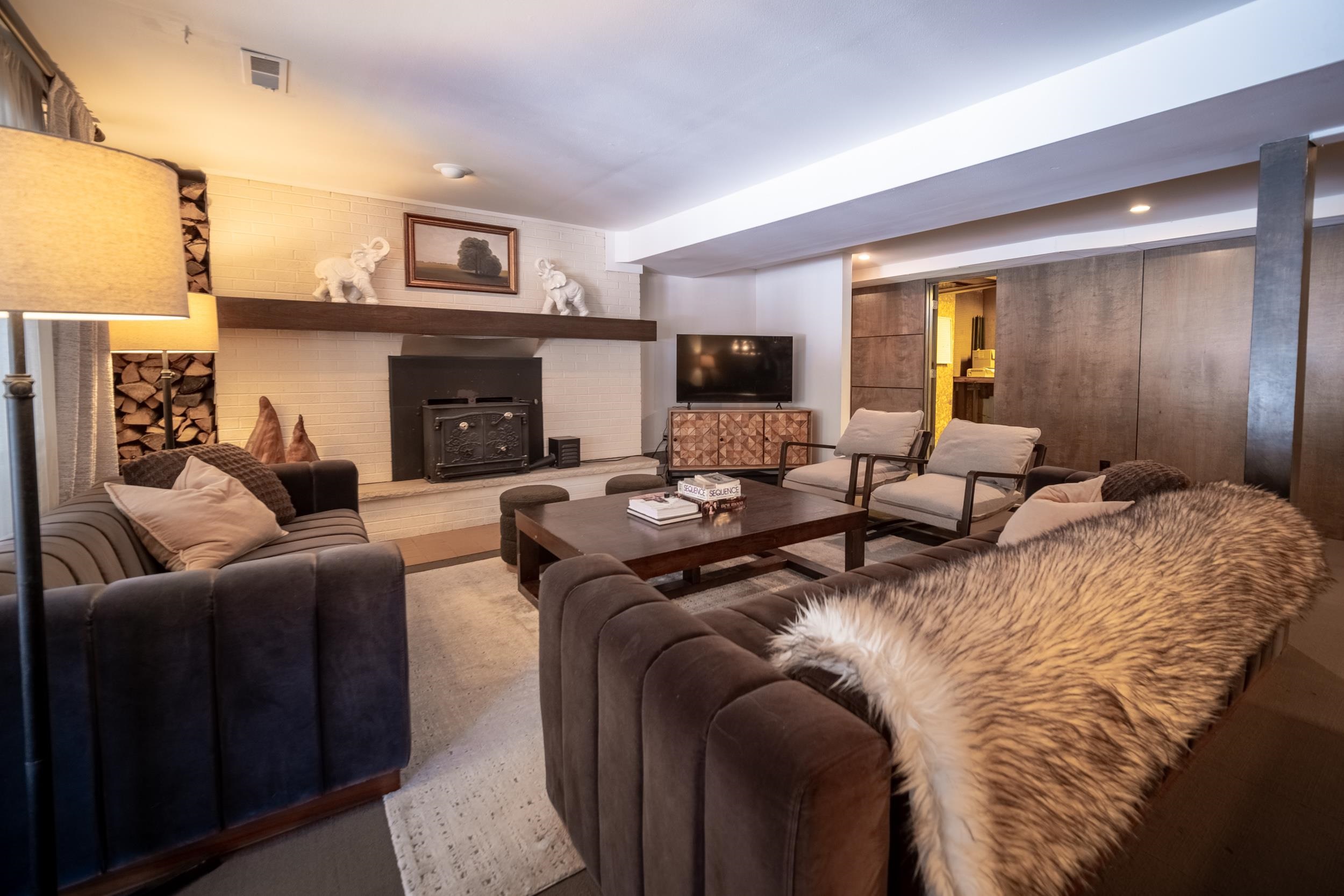 6811 West Gate Road Roscoe, IL 61073 - Photo 41 of 61 a living room with furniture and a fireplace