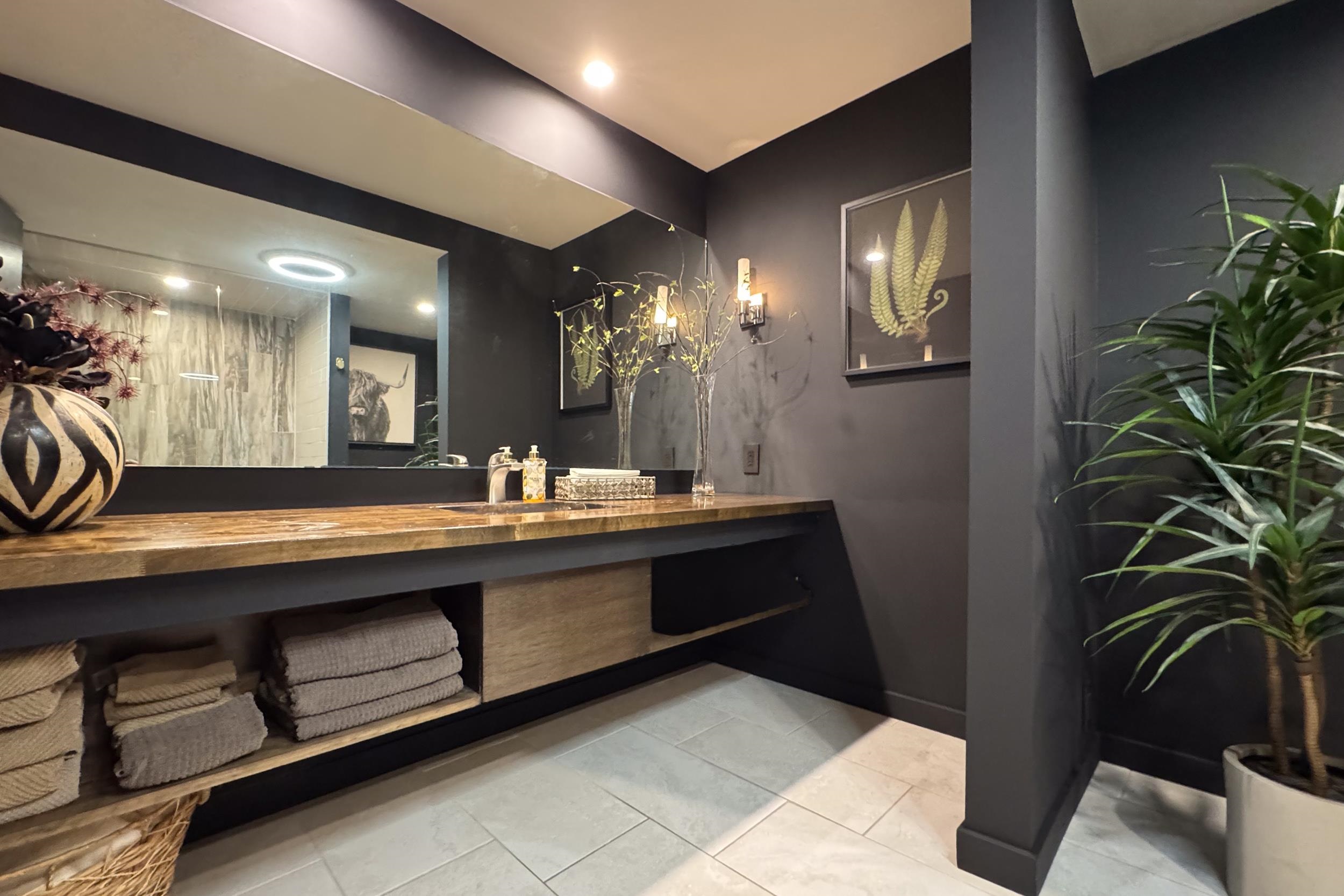 6811 West Gate Road Roscoe, IL 61073 - Photo 46 of 61 a bathroom with a sink and a mirror