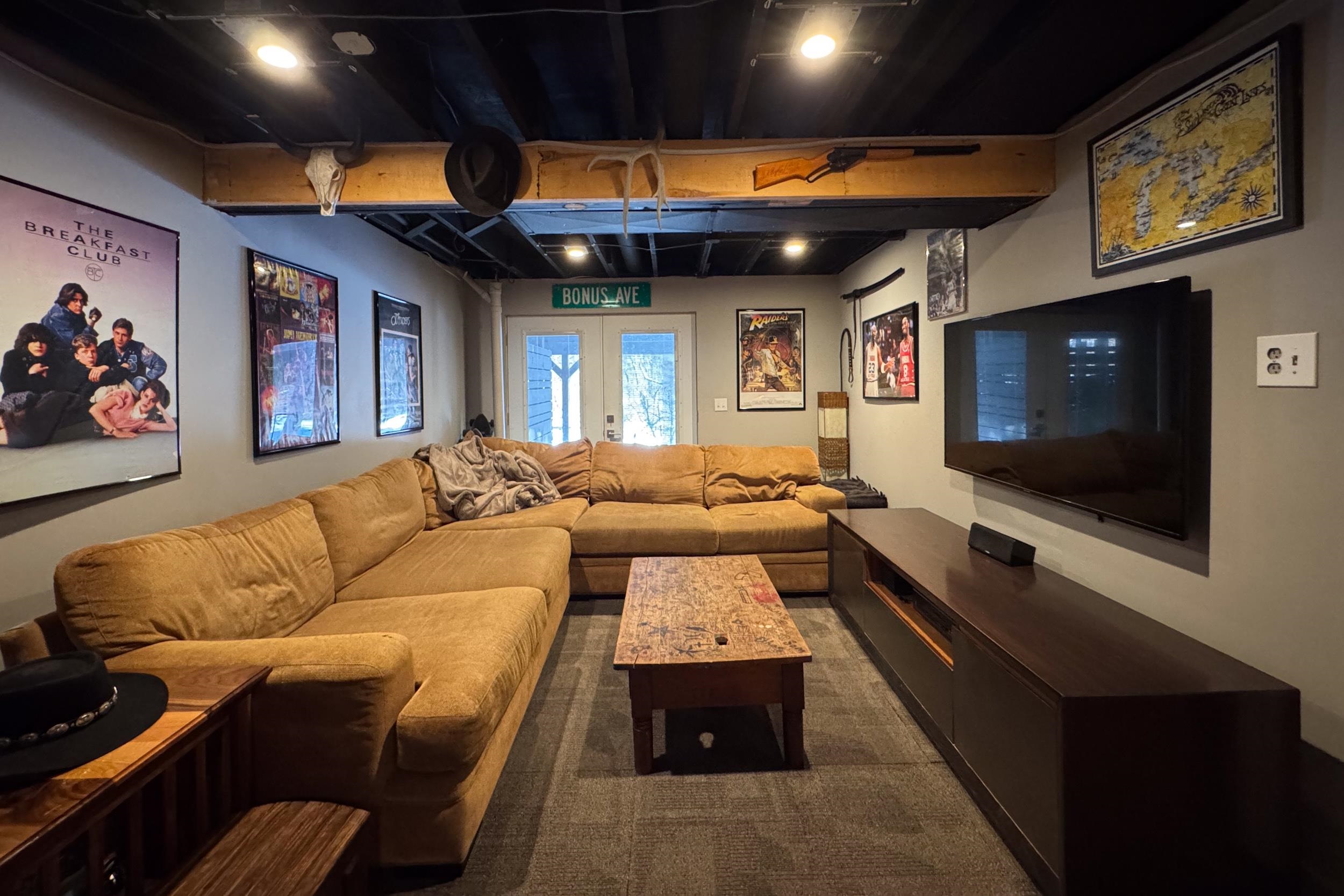 6811 West Gate Road Roscoe, IL 61073 - Photo 49 of 61 a living room with furniture and a flat screen tv
