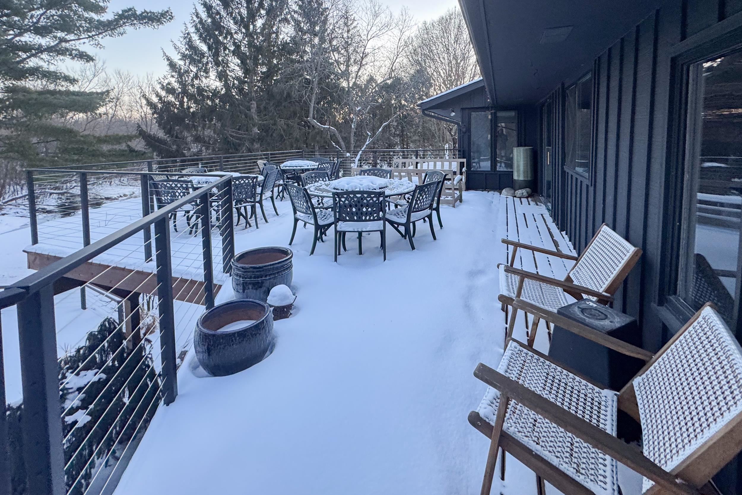 6811 West Gate Road Roscoe, IL 61073 - Photo 53 of 61 a view of a patio with chairs and potted plants