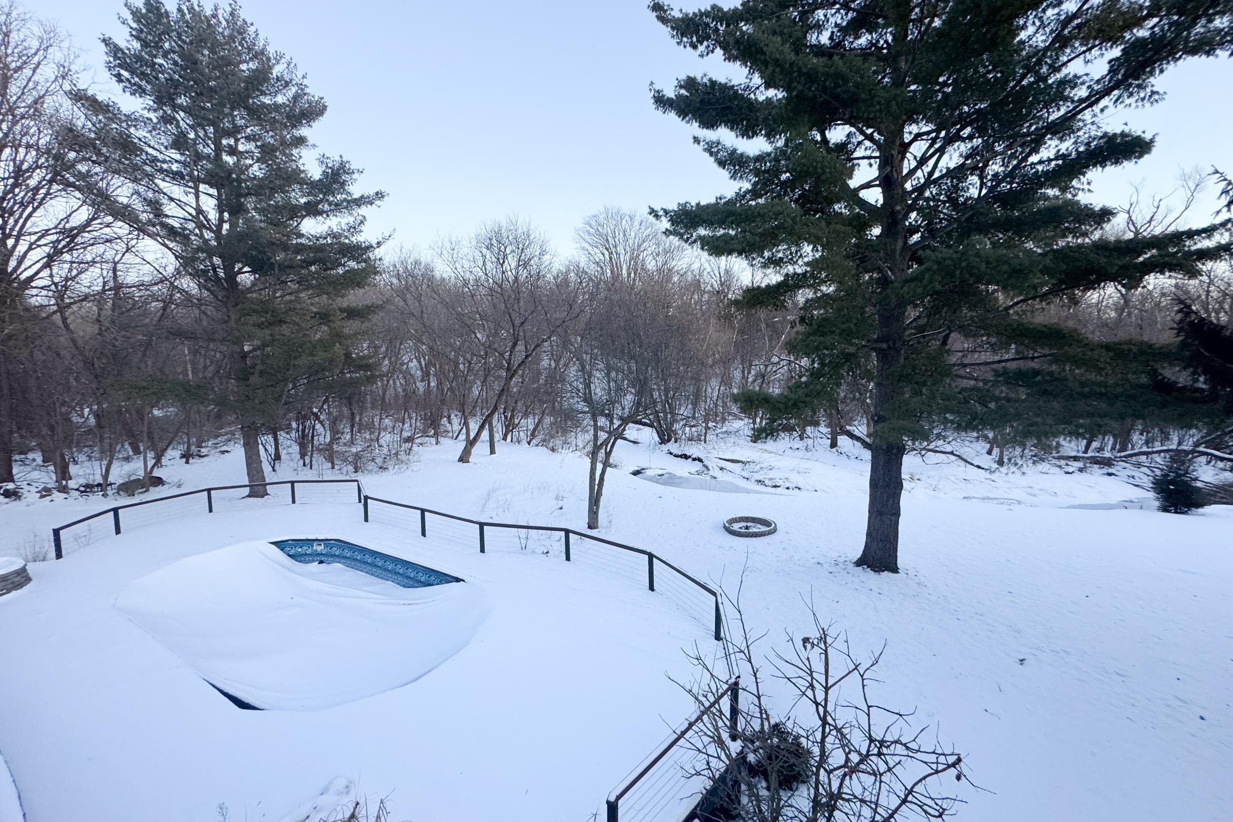 6811 West Gate Road Roscoe, IL 61073 - Photo 56 of 61 a view of a snow with trees in the background