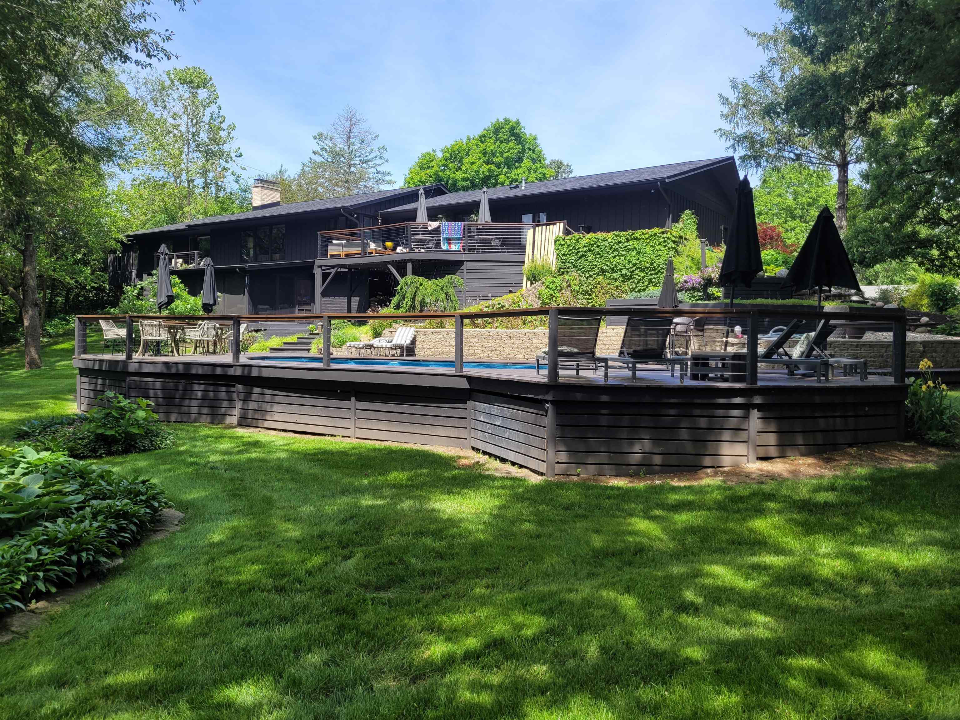 6811 West Gate Road Roscoe, IL 61073 - Photo 59 of 61 a view of house with swimming pool yard outdoor seating and green space