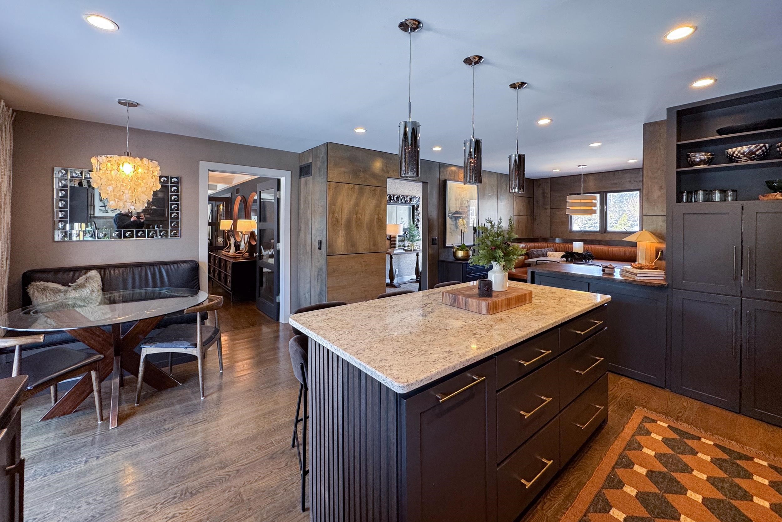 6811 West Gate Road Roscoe, IL 61073 - Photo 9 of 61 a kitchen with stainless steel appliances granite countertop sink refrigerator and wooden floor