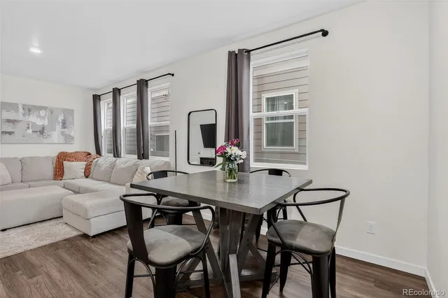 a view of a livingroom with furniture and a table