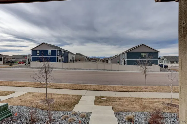 a view of a street in front of a house