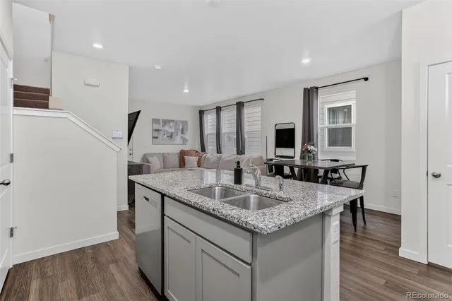 a kitchen with center island and stainless steel appliances