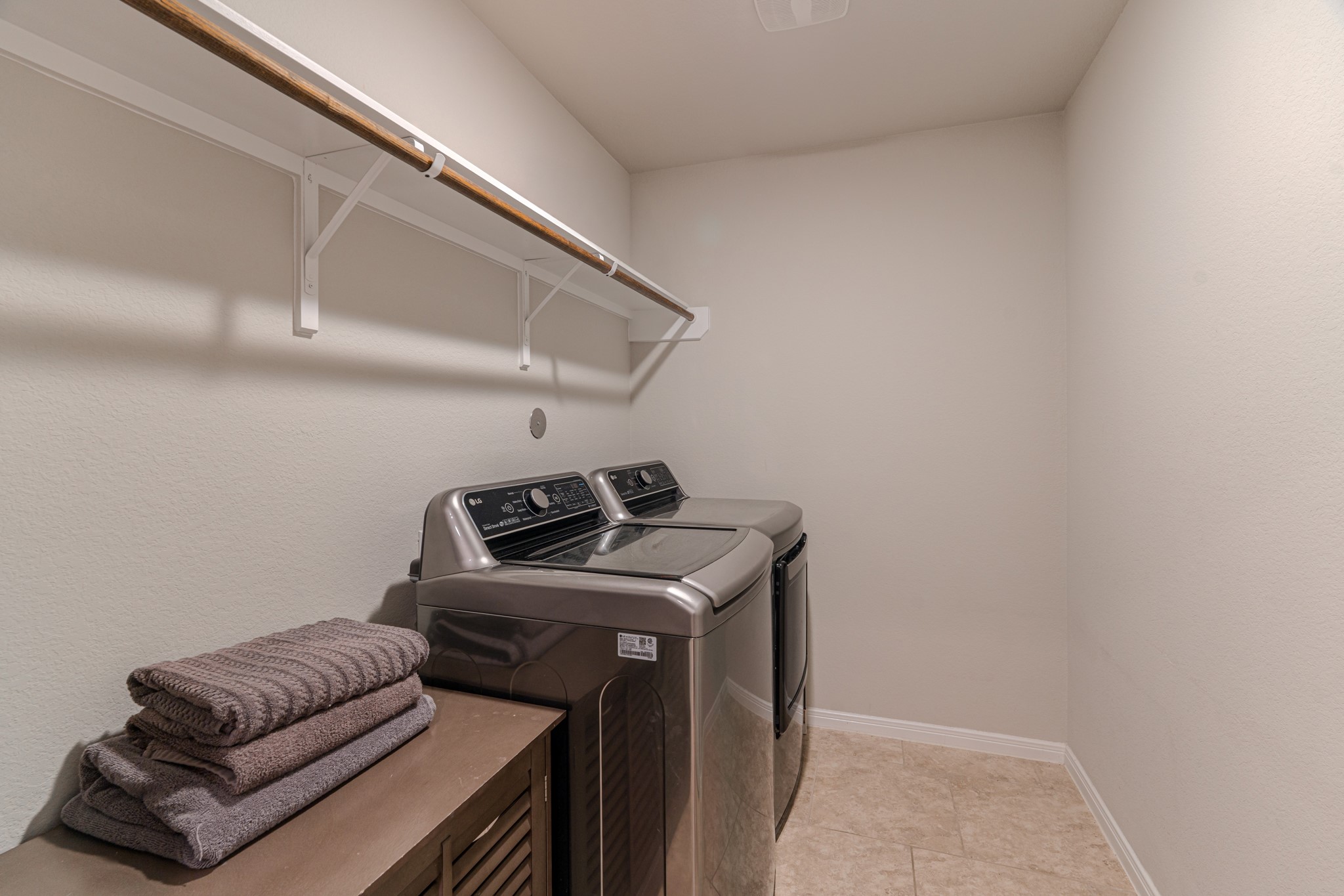 14207 Irvine Rnch Trail Conroe, TX 77384 - Photo 24 of 29 a utility room with dryer and washer