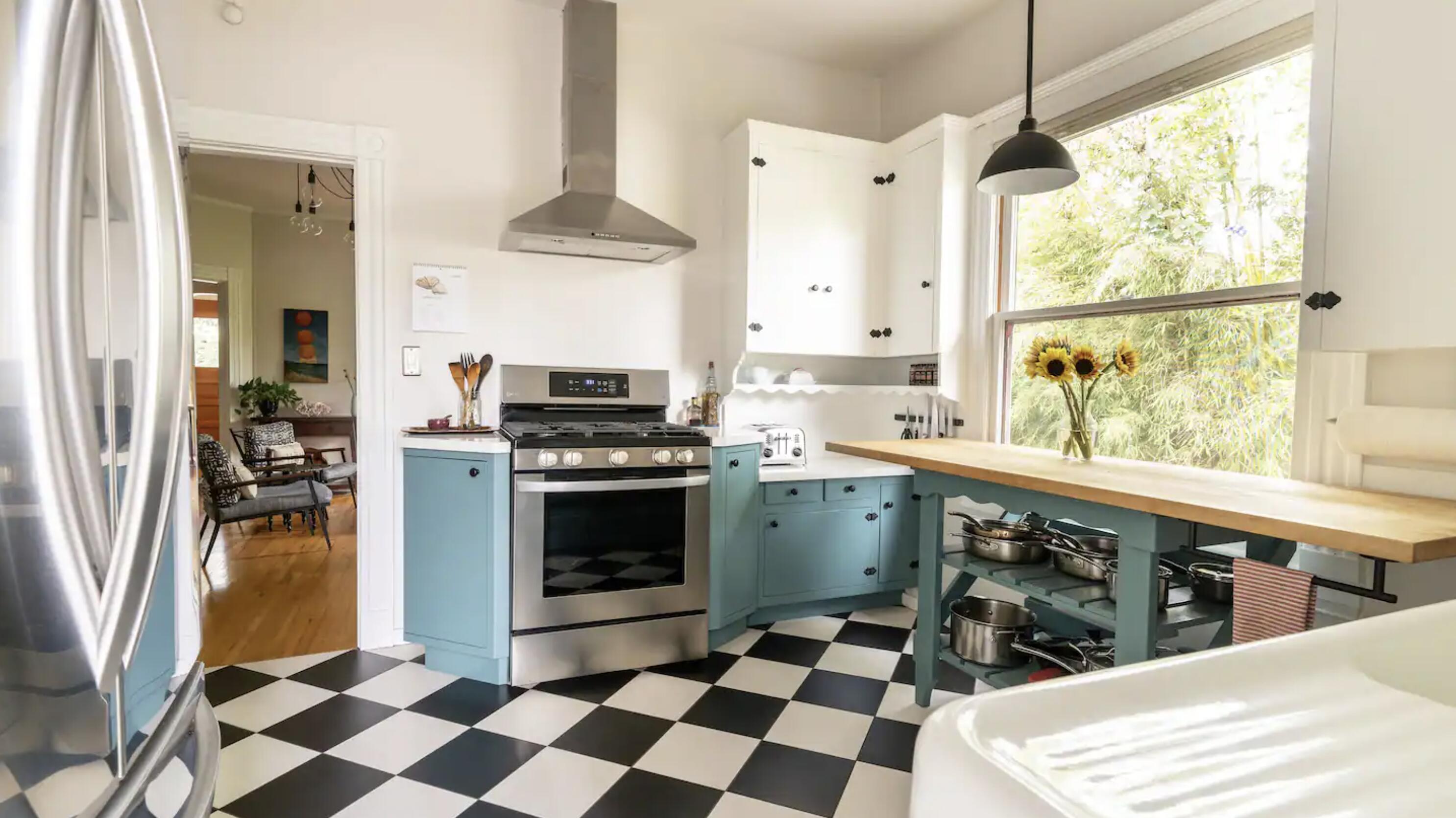 1608 Bath Street Santa Barbara, CA 93101 - Photo 4 of 15 a kitchen with a stove a sink and a refrigerator