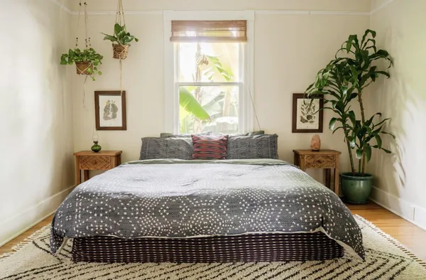 a bedroom with a large bed and a window