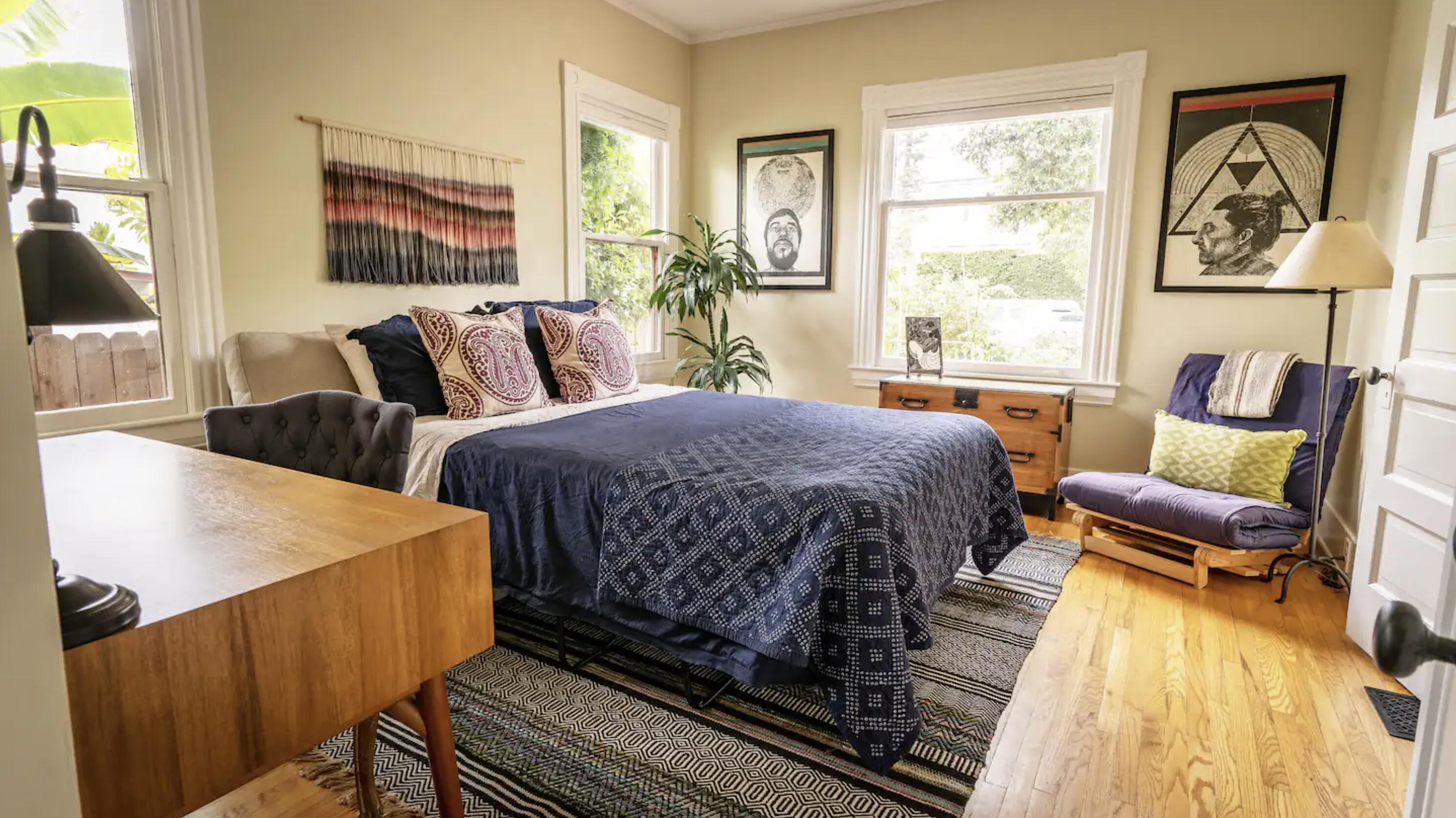 1608 Bath Street Santa Barbara, CA 93101 - Photo 7 of 15 a bedroom with a bed and wooden floor