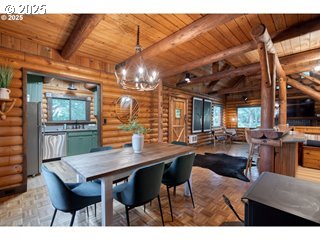 67930 East Stage Stop Road Welches, OR 97067 - Photo 11 of 43 a view of a dining room with furniture and wooden floor