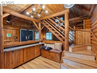 67930 East Stage Stop Road Welches, OR 97067 - Photo 14 of 43 a view of living room kitchen with furniture and stairs