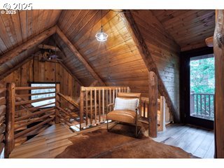 67930 East Stage Stop Road Welches, OR 97067 - Photo 20 of 43 a view of a livingroom with furniture and staircase