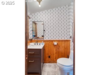 67930 East Stage Stop Road Welches, OR 97067 - Photo 22 of 43 a bathroom with a granite countertop toilet sink and mirror