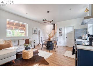 67930 East Stage Stop Road Welches, OR 97067 - Photo 27 of 43 a living room with dining room and wooden floor