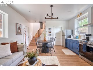 67930 East Stage Stop Road Welches, OR 97067 - Photo 28 of 43 a living room with furniture dining table and a chandelier