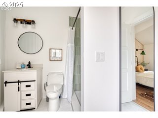 67930 East Stage Stop Road Welches, OR 97067 - Photo 37 of 43 a bathroom with a toilet a sink and a mirror